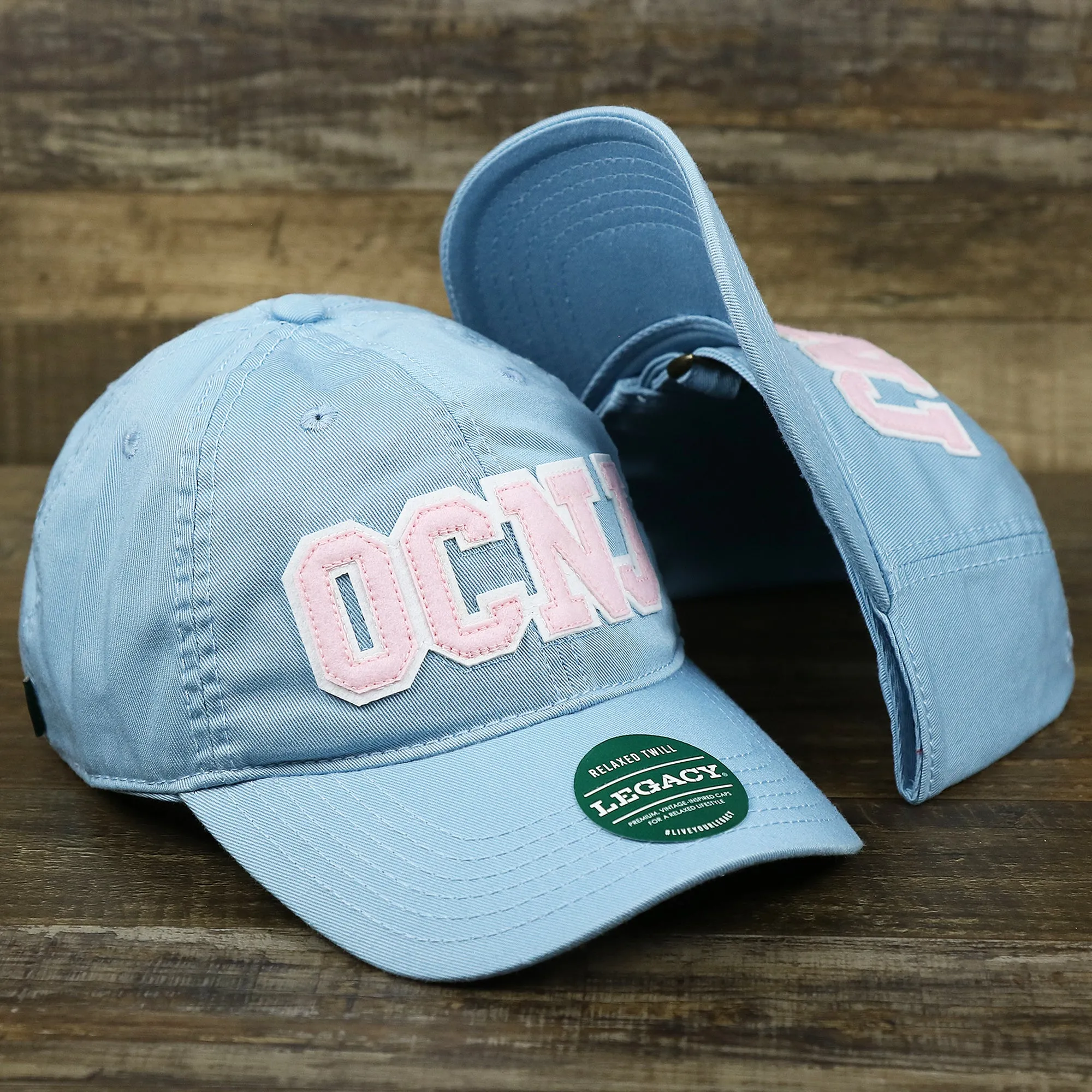 Pink OCNJ Wordmark White Outline Dad Hat | Light Blue Dad Hat