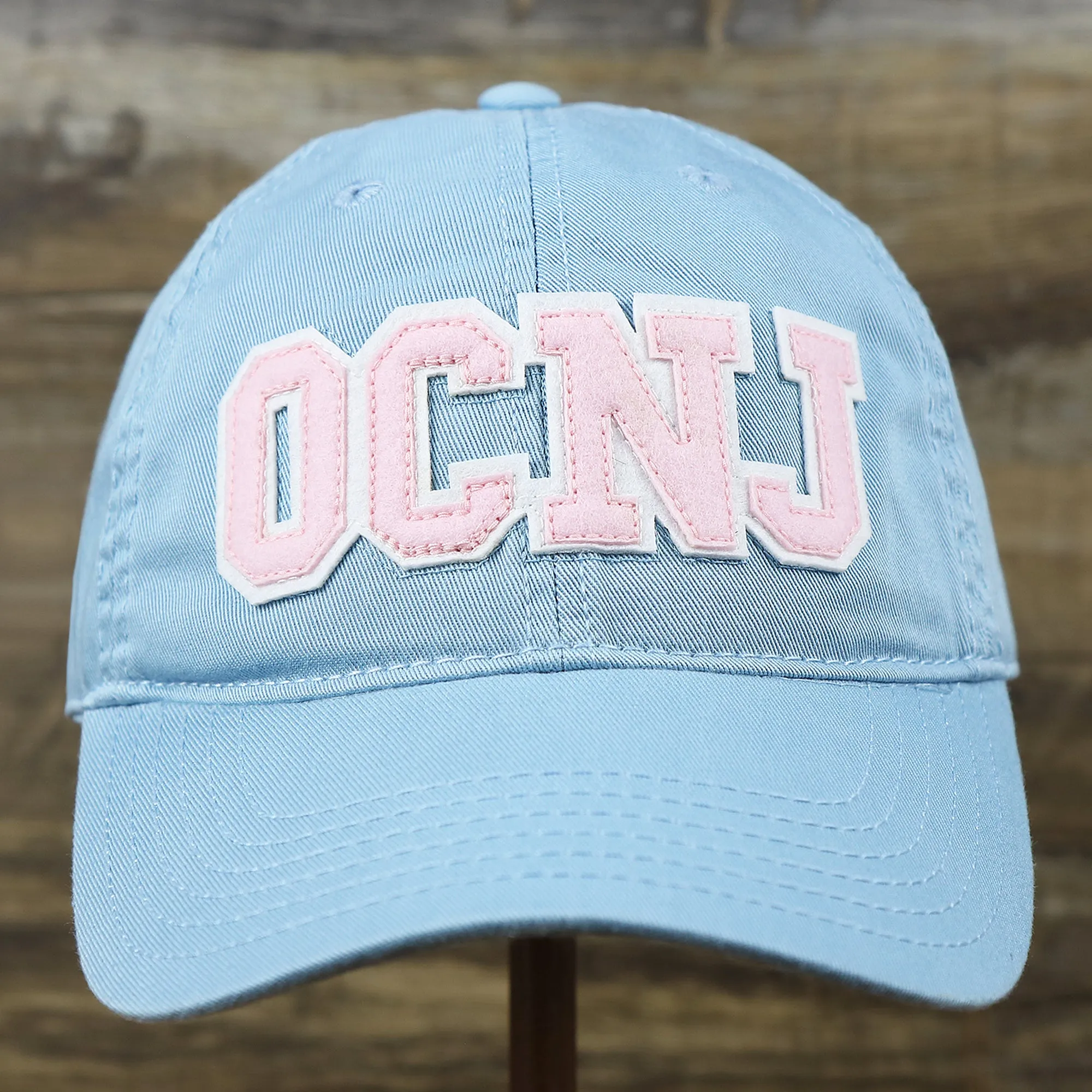 Youth Pink OCNJ Wordmark White Outline Dad Hat | Youth Light Blue Dad Hat